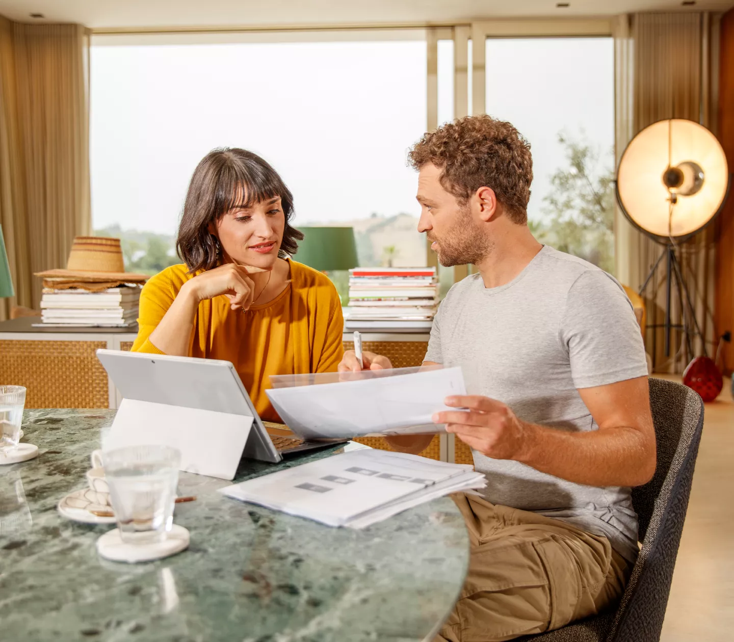 Woman sitting with installer planning system